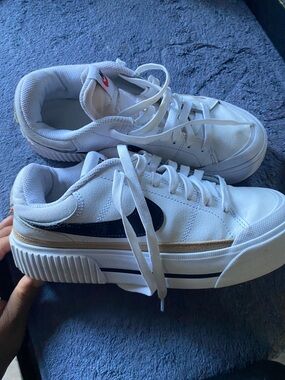 Nike White Low-Top Sneakers with Navy Swoosh and Tan Stripe
